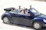 ibiza 27 juni 2016
Sonja Bakker met man Jan Reus en zoon Bram bij cala Bassa. Ze rijden in een VW kever cabrio.