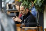 Amsterdam 12 juli 2017
Rolf Snieren op terras met zijn mobiel.