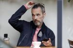 Amsterdam 12 juli 2017
Rolf Snieren op terras met zijn mobiel.