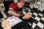 Eindhoven 28 augustus 2018
Rolf Tangel laat bij Dannyâ€™s tattooshop in Eindhoven zijn Barbie Samantha tatoos weghalen.