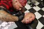 Eindhoven 28 augustus 2018
Rolf Tangel laat bij Dannyâ€™s tattooshop in Eindhoven zijn Barbie Samantha tatoos weghalen.