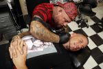 Eindhoven 28 augustus 2018
Rolf Tangel laat bij Dannyâ€™s tattooshop in Eindhoven zijn Barbie Samantha tatoos weghalen.
