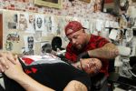 Eindhoven 28 augustus 2018
Rolf Tangel laat bij Dannyâ€™s tattooshop in Eindhoven zijn Barbie Samantha tatoos weghalen.