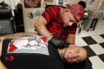 Eindhoven 28 augustus 2018
Rolf Tangel laat bij Dannyâ€™s tattooshop in Eindhoven zijn Barbie Samantha tatoos weghalen.