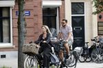 Amsterdam 28 augustus 2019
Candy Dulfer met vriend Rafael op terras en daarna op de fiets in Amsterdam.