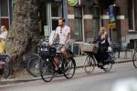 Amsterdam 28 augustus 2019
Candy Dulfer met vriend Rafael op terras en daarna op de fiets in Amsterdam.