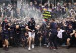 ABU DHABI, UNITED ARAB EMIRATES - DECEMBER 12: Race winner and 2021 F1 World Drivers Champion Max Verstappen of Netherlands and Red Bull Racing celebrates with his team after the F1 Grand Prix of Abu Dhabi at Yas Marina Circuit on December 12, 2021 in Abu Dhabi, United Arab Emirates. (Photo by Lars Baron/Getty Images) // Getty Images / Red Bull Content Pool  // SI202112120614 // Usage for editorial use only //