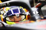 ABU DHABI, UNITED ARAB EMIRATES - DECEMBER 15: Sergio Perez of Mexico and Red Bull Racing prepares to drive in the garage during Formula 1 testing at Yas Marina Circuit on December 15, 2021 in Abu Dhabi, United Arab Emirates. (Photo by Clive Rose/Getty Images)