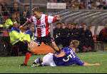Eindhoven, 28 September 1999
Wedstrijd uit de voorronde van de CHAMPIONS-League tussen PSV & Glasgow Rangers, eindstand 0-1
Dennis Rommedahl in duel met Arthur Numan