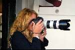 Amsterdam 12 september 2003
Inge de Bruijn  als fotografe met een foto camera op pc hooftstraat