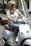 Amsterdam 24 september 2005
Connie Breukhoven op vespa scooter op cornelis schuytstraat