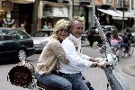 Amsterdam 24 september 2005
Hans Breukhoven en Connie Breukhoven op vespa scooter op cornelis schuytstraat