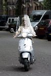 Amsterdam 24 september 2005
Connie Breukhoven op vespa scooter op cornelis schuytstraat