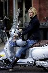 Amsterdam 17 september 2005
Estelle Gullit op vespa scooter op cornelis schuytstraat