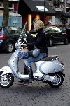 Amsterdam 17 september 2005
Estelle Gullit op vespa scooter op cornelis schuytstraat