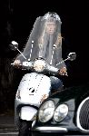 Amsterdam 17 september 2005
Estelle Gullit op vespa scooter op cornelis schuytstraat