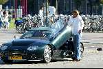 Amsterdam 25 september 2003
Winston Gerschtanowitz in SpykerCabrio van 250 000 euro
bellend met zijn gsm