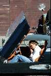 Amsterdam 25 september 2003
Winston Gerschtanowitz in SpykerCabrio van 250 000 euro
bellend met zijn gsm