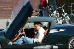 Amsterdam 25 september 2003
Winston Gerschtanowitz in SpykerCabrio van 250 000 euro
bellend met zijn gsm