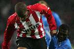 Eindhoven, 5 November 2005 
Kompetitiewedstrijd Seizoen 2005/2006 
PSV-Sparta eindstand 3-0
Jefferson Farfan grijpt het shirt van zijn tegenstander stevig vast
© Foto Bart Bel